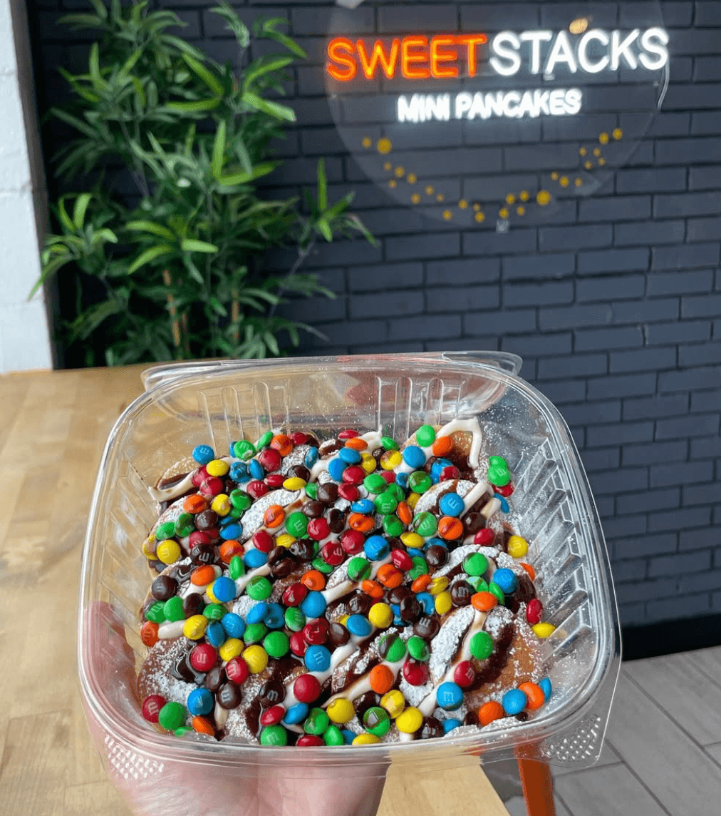 Mini pancake stack with sauce and toppings